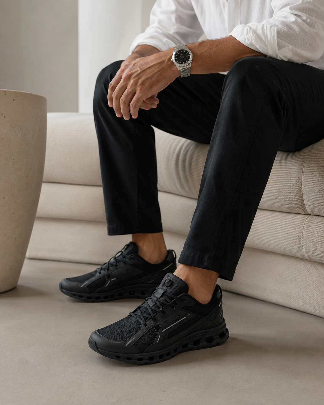 Minimal black sneakers lifestyle shot